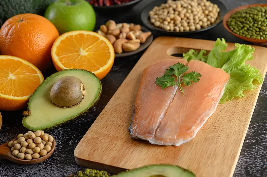 Vitamín D a ingredience - legumes,fruit,salmon,fish,pieces,wooden,chopping-board